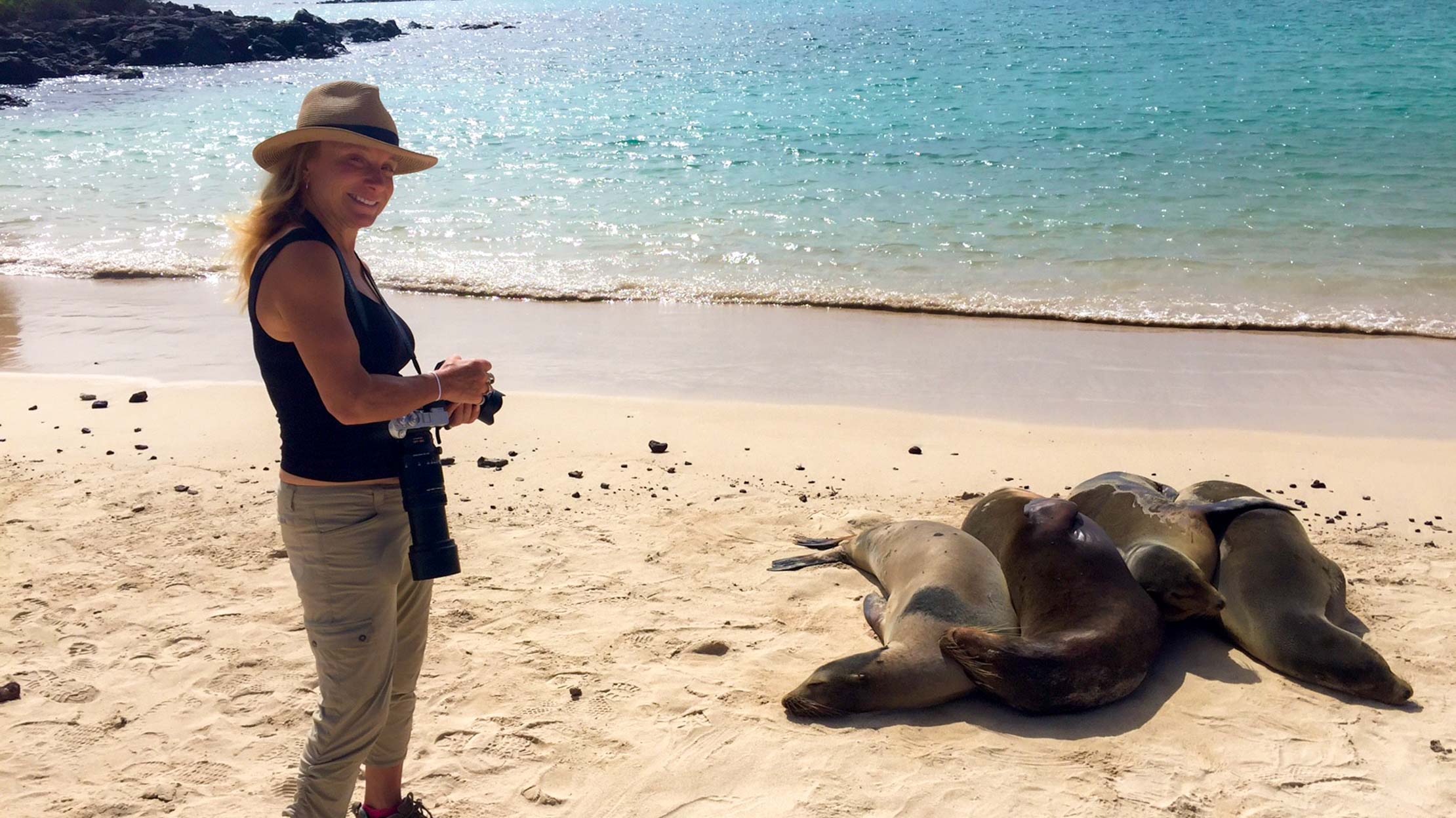 Lauren Hefferon next to seals in the Galapagos Islands