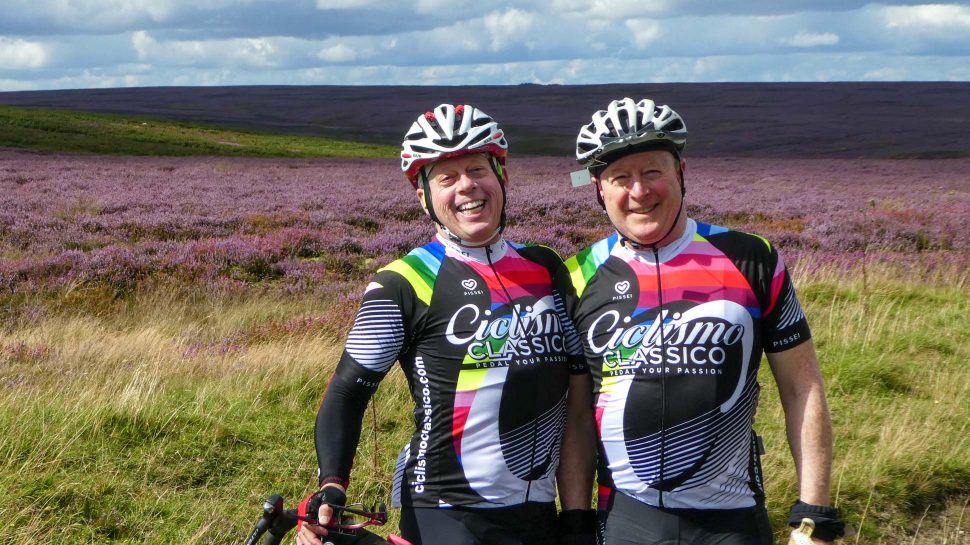 Bikers in England next to a field of flowers