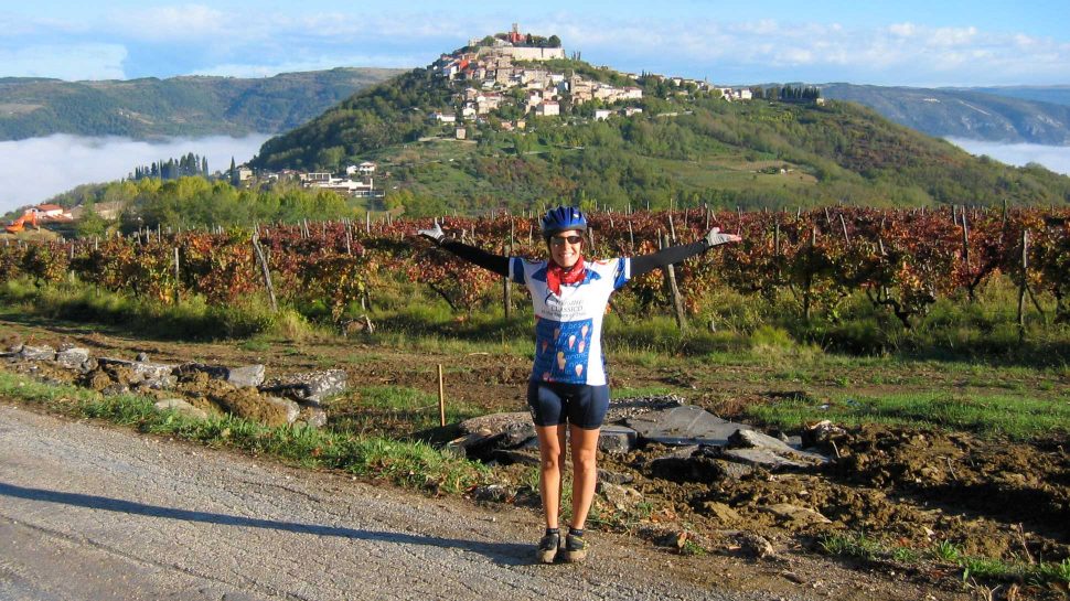 Bike guide posing by mountain on the Croatia's Istrian Peninsula tour