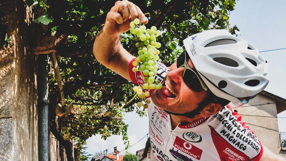Biker eating grapes on Friuli and Slovenia tour