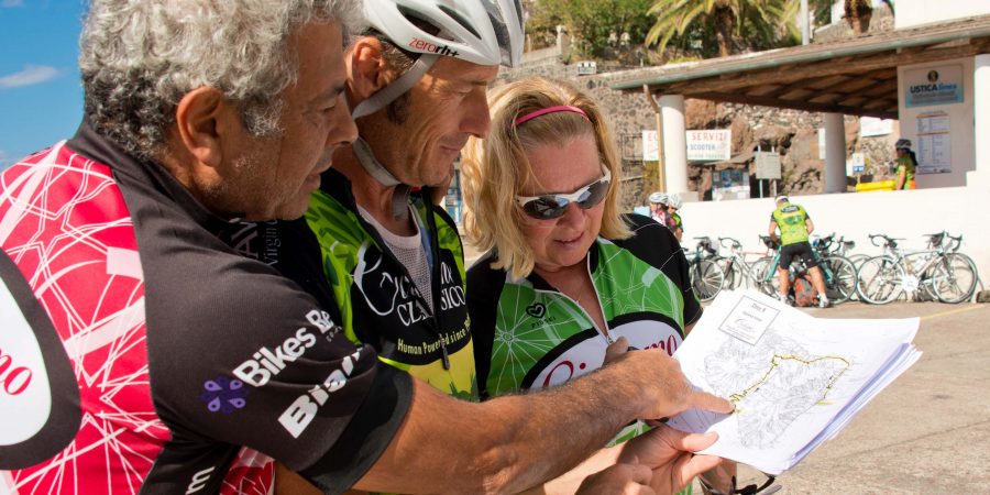 Bikers studying map in La Bella Sicilia